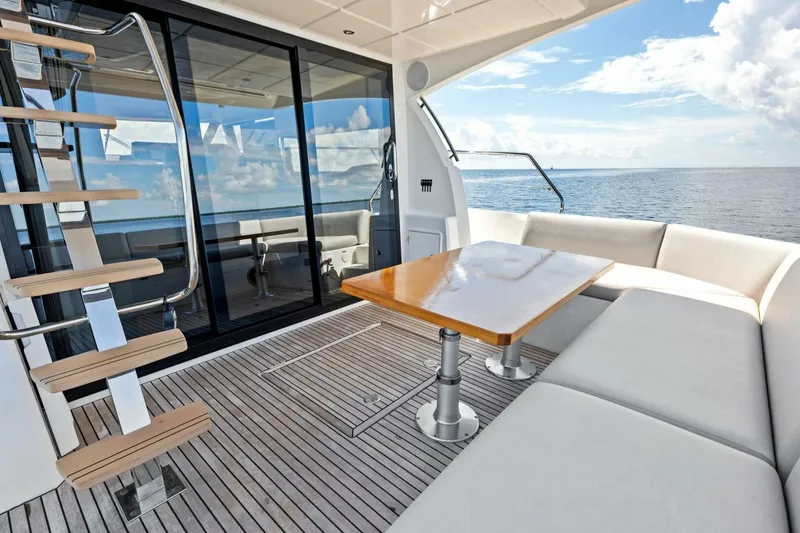 Slide: The Image of Luxurious 2023 Prestige 460 Flybridge yacht with elegant seating and ocean view. - 44