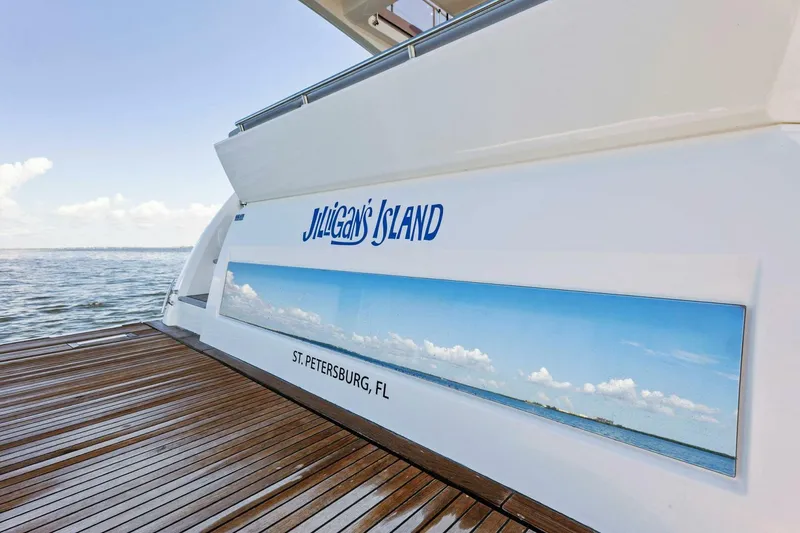 Slide: The Image of Prestige 460 Flybridge yacht, 2023 model, docked in St. Petersburg, FL, with ocean view. - 46
