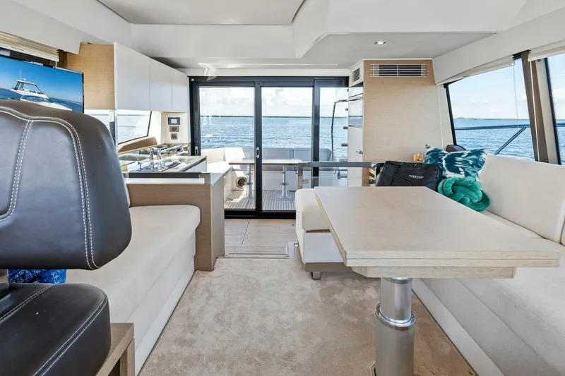 Slide: The Image of Luxurious interior of 2023 Prestige 460 Flybridge yacht with ocean view. - 8