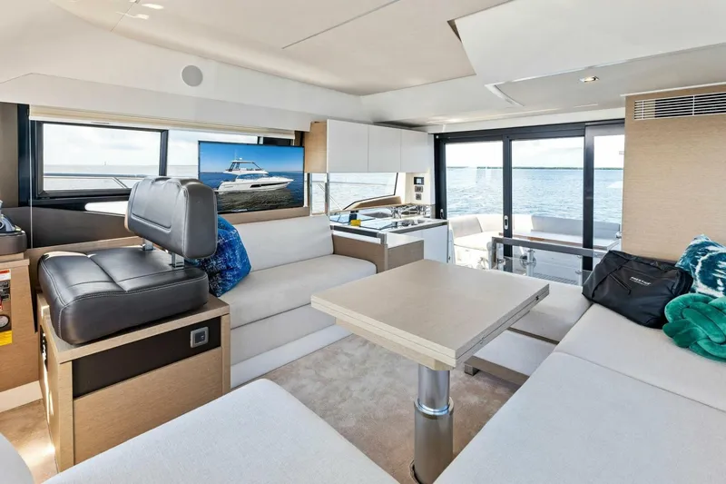 Slide: The Image of Luxurious interior of 2023 Prestige 460 Flybridge yacht with modern furnishings and ocean view. - 9