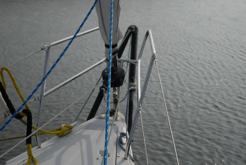 Slide: The Image of Bow of 2003 Beneteau 36.7 sailboat with ropes and calm water. - 12