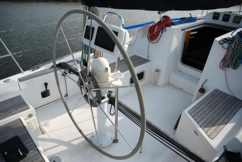 Slide: The Image of Cockpit of 2003 Beneteau 36.7 sailboat with steering wheel and navigation equipment. - 16