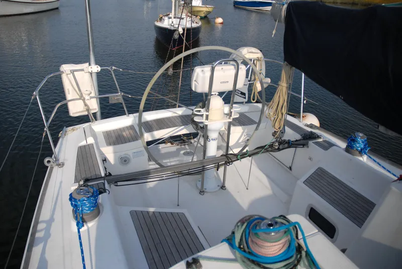 Slide: The Image of 2003 Beneteau 36.7 sailboat cockpit with steering wheel and rigging. - 19