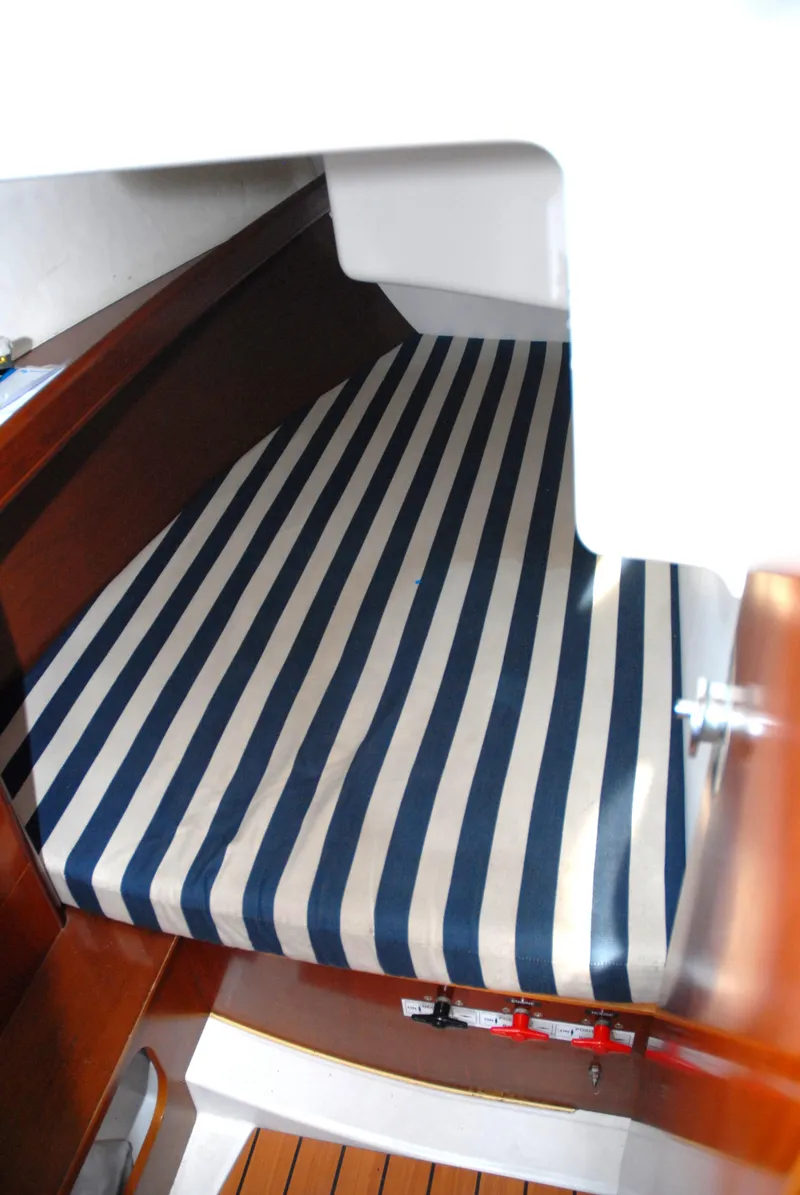 Slide: The Image of Beneteau 36.7 2003 cabin with striped mattress, wooden interior. - 31