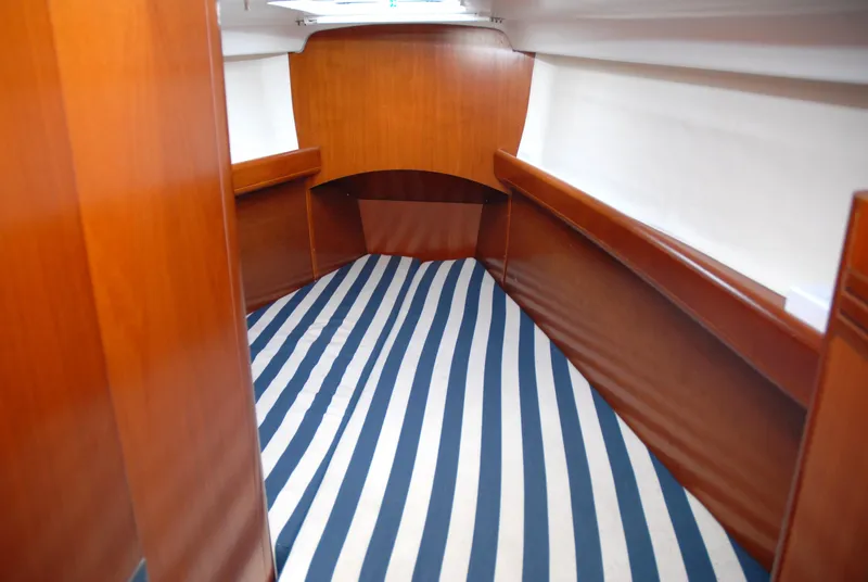 Slide: The Image of Interior cabin of 2003 Beneteau 36.7 sailboat with striped flooring. - 32