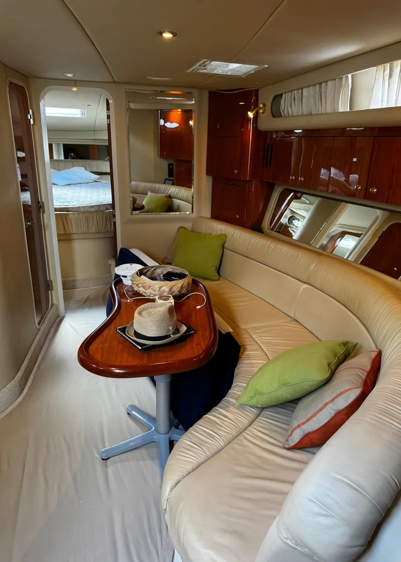 Slide: The Image of Luxurious interior of 2001 Sea Ray 410 Sundancer yacht with plush seating and elegant decor. - 13