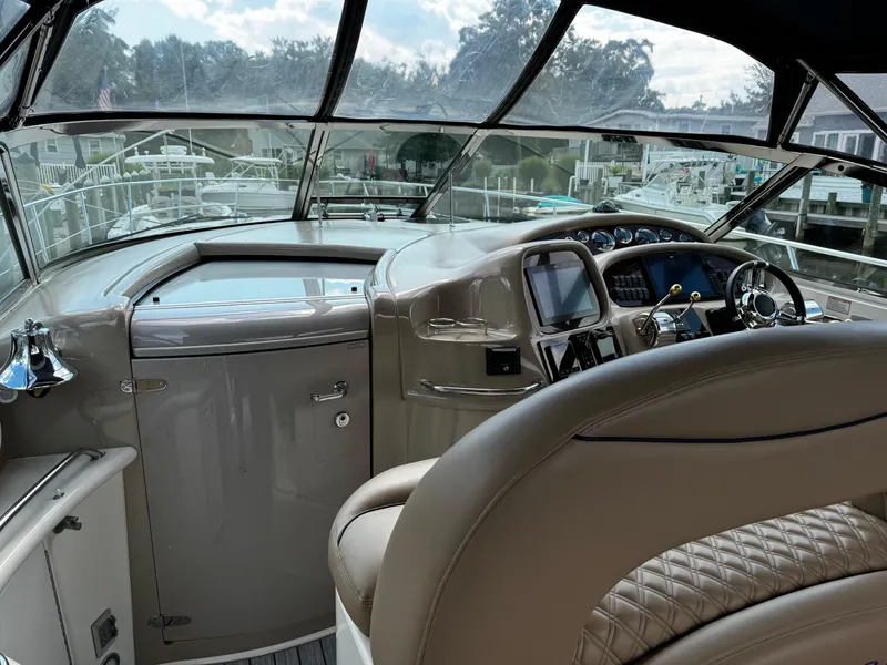 Slide: The Image of Interior cockpit of 2001 Sea Ray 410 Sundancer yacht with steering wheel and dashboard. - 20
