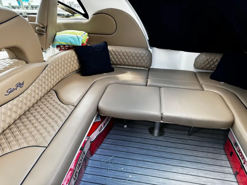 Slide: The Image of Luxurious interior of 2001 Sea Ray 410 Sundancer yacht with beige seating. - 21