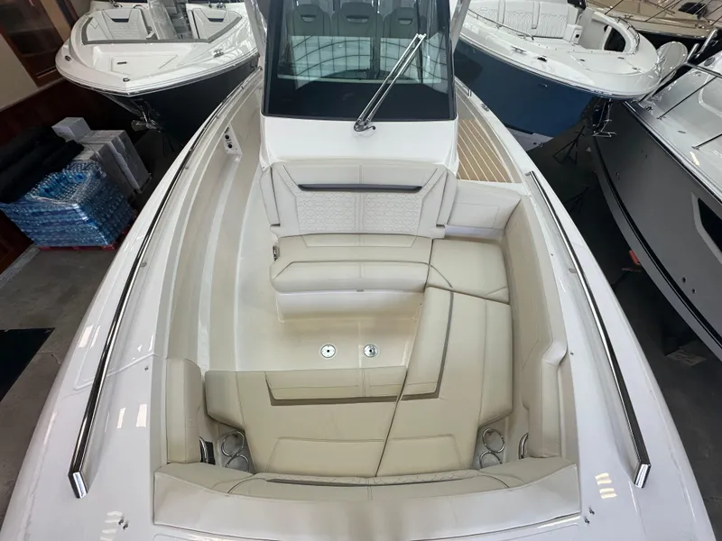 Slide: The Image of 2025 Tiara Yachts 34 LS boat interior with luxurious seating and sleek design. - 13