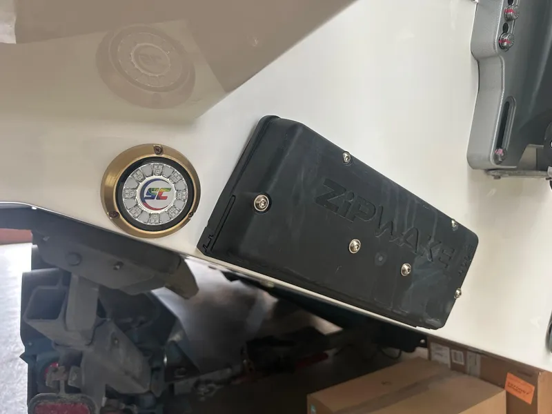 Slide: The Image of 2025 Tiara Yachts 34 LS, close-up of Zipwake system and gauge on the hull. - 19