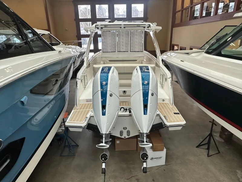 Slide: The Image of 2025 Tiara Yachts 34 LS with dual engines in showroom. - 3