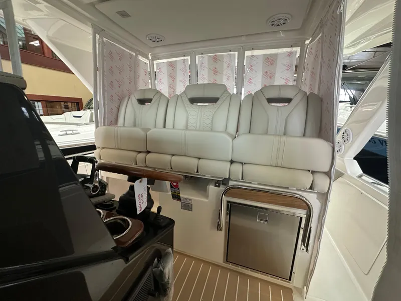 Slide: The Image of 2025 Tiara Yachts 34 LS interior with luxurious seating and modern amenities. - 8