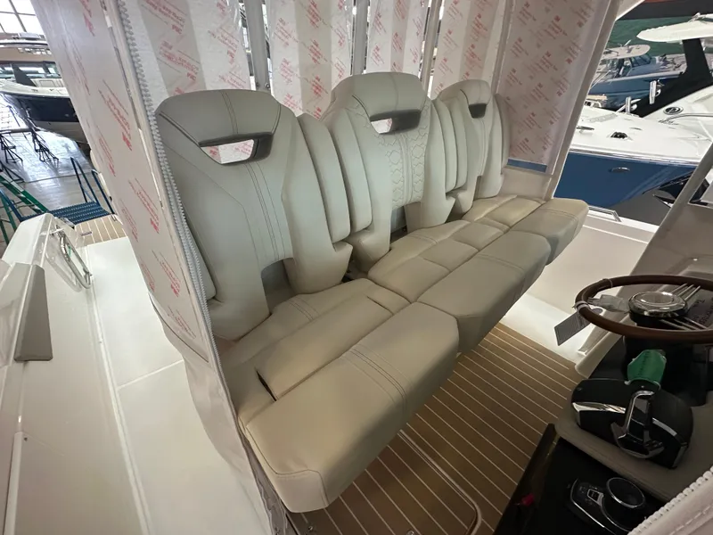 Slide: The Image of 2025 Tiara Yachts 34 LS interior with luxurious seating and modern helm controls. - 9