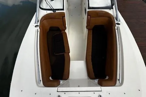 Slide: The Image of 2015 Scout 275 Dorado boat interior with brown and black seating. - 16
