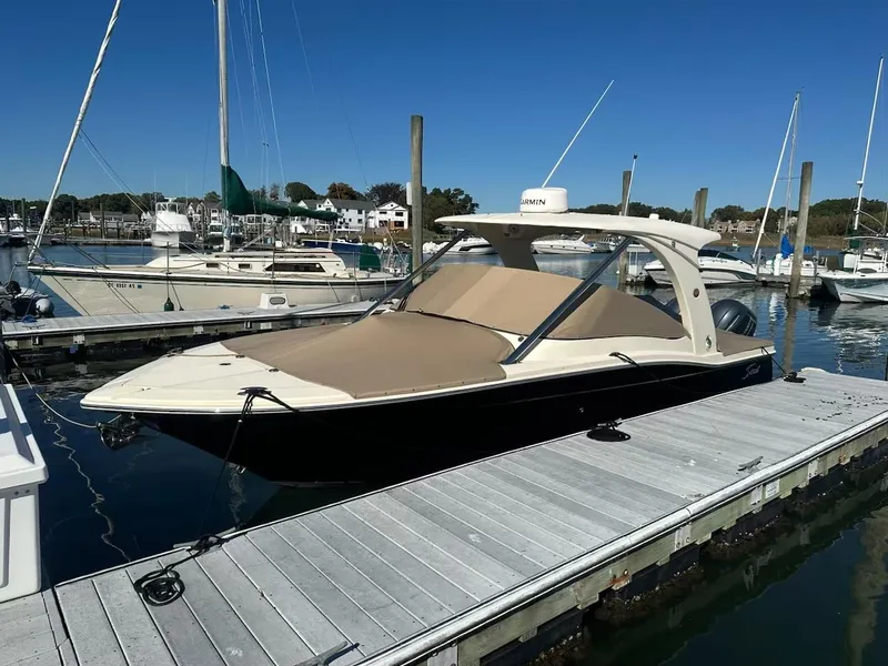Slide: The Image of 2015 Scout 275 Dorado boat docked at marina under clear blue sky. - 27