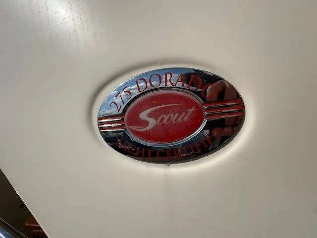 Slide: The Image of Scout 275 Dorado 2015 yacht emblem on white surface. - 8