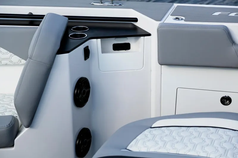 Slide: The Image of Interior of 2025 Fountain 38 SCX boat with gray seating and cup holders. - 12
