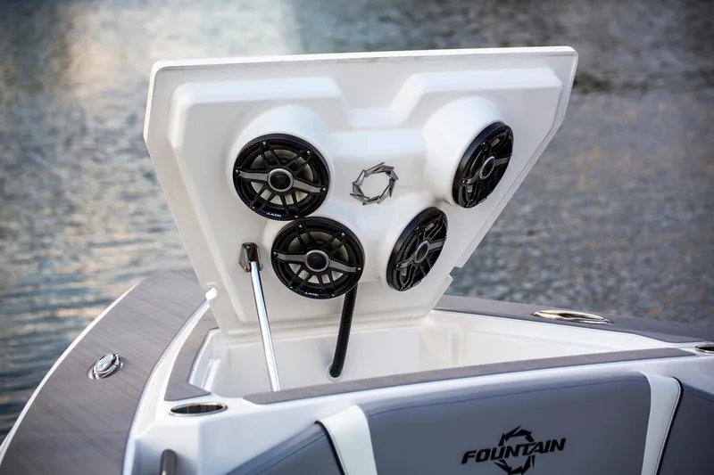 Slide: The Image of 2025 Fountain 38 SCX boat with open hatch and speakers on water. - 8