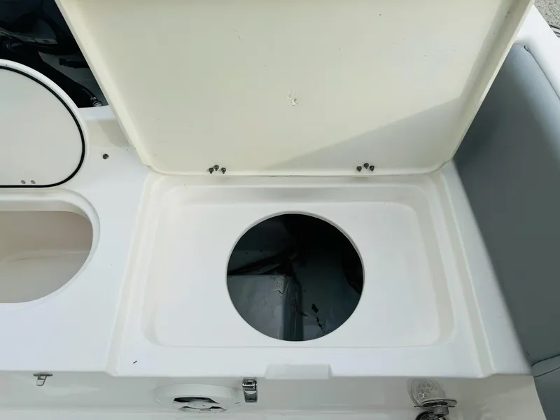 Slide: The Image of Open storage compartment on 2022 NauticStar 2102 Legacy boat. - 23