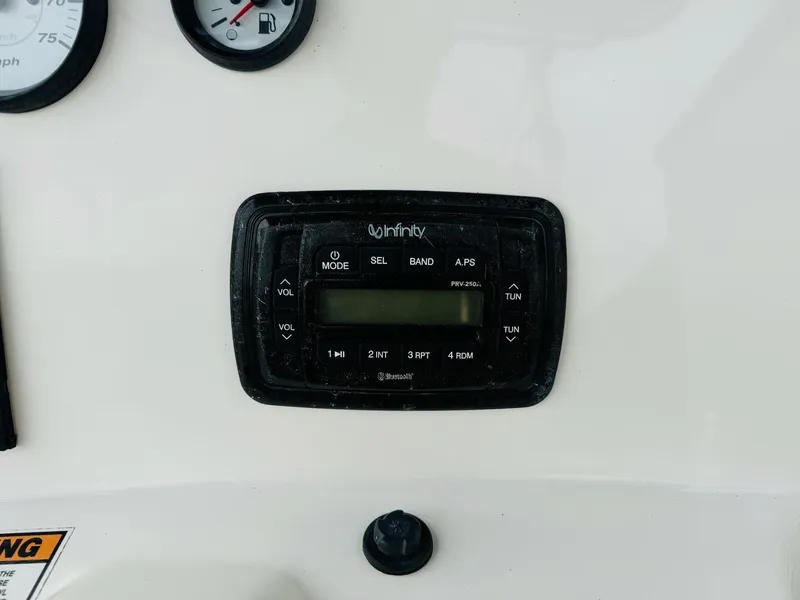 Slide: The Image of Infinity stereo system on 2022 NauticStar 2102 Legacy boat dashboard. - 29