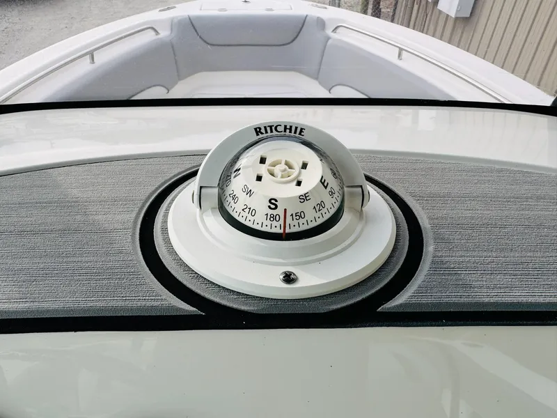 Slide: The Image of Compass on 2022 NauticStar 2102 Legacy boat dashboard, featuring Ritchie navigation instrument. - 30