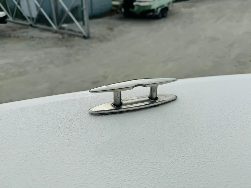 Slide: The Image of 2022 NauticStar 2102 Legacy boat cleat on deck, close-up view. - 41