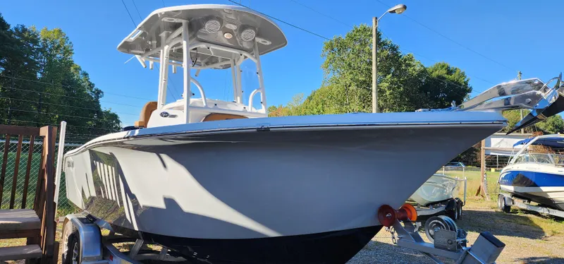 The Image of 2025 Seapro 222CC boat on trailer, sunny day, outdoor display. - 1