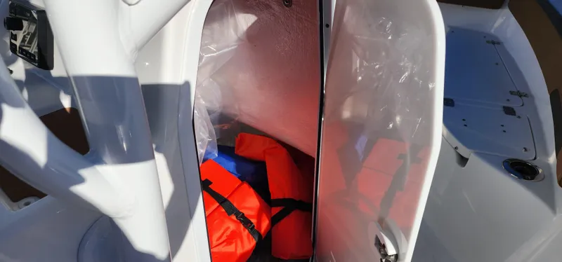 Slide: The Image of 2025 Seapro 222CC boat storage compartment with life jackets. - 6