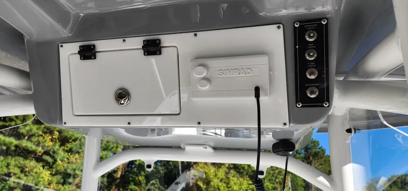 Slide: The Image of 2025 Seapro 222CC boat console with storage and control panel. - 8