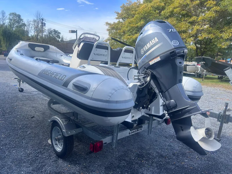 Slide: The Image of 2023 Highfield Sport 460 boat with Yamaha engine on trailer. - 5