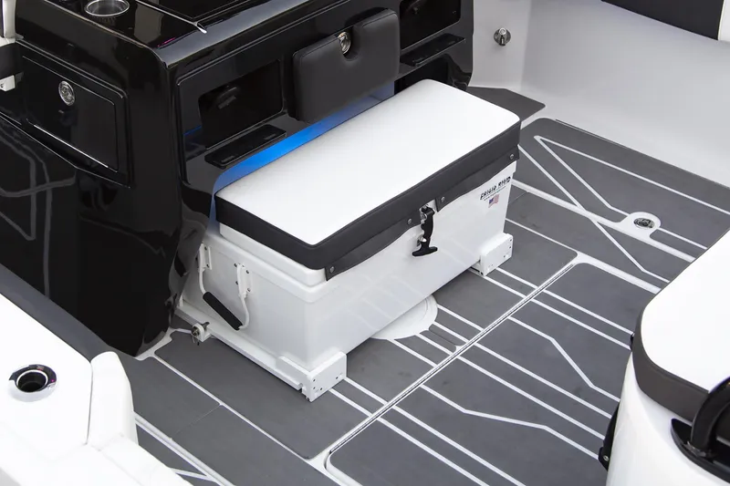 Slide: The Image of 2025 Fountain 32 NX boat interior with cooler and sleek flooring design. - 5