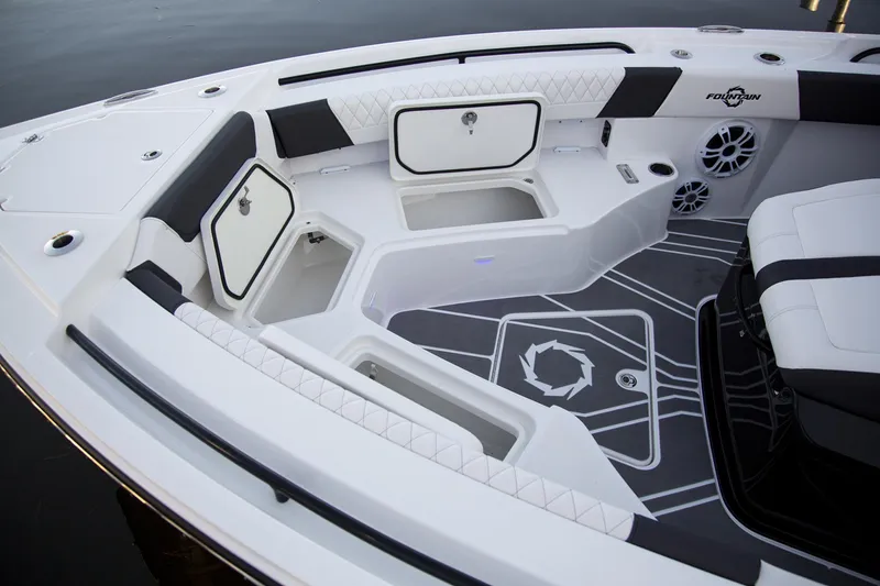 Slide: The Image of 2025 Fountain 32 NX boat interior with storage compartments and seating. - 6