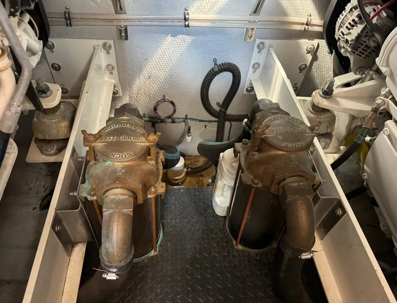Slide: The Image of Engine room of 2006 Silverton 43 Sport Bridge with visible mechanical components. - 18