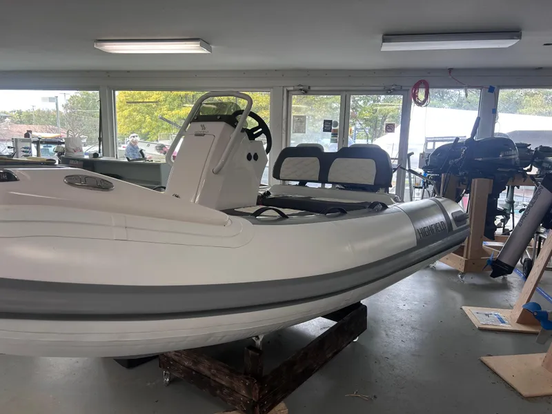 Slide: The Image of 2022 Highfield Sport 300 inflatable boat in showroom, side view. - 6