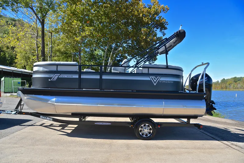 Slide: The Image of 2023 Viaggio DM18U pontoon boat on trailer by a lake. - 10