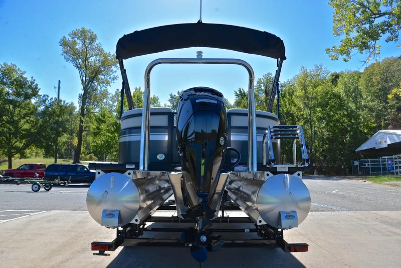 Slide: The Image of 2023 Viaggio DM18U pontoon boat with outboard motor, parked on a trailer. - 12