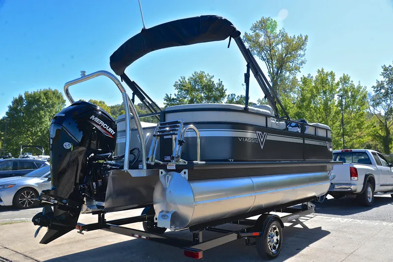 Slide: The Image of 2023 Viaggio DM18U pontoon boat with Mercury engine on trailer. - 13