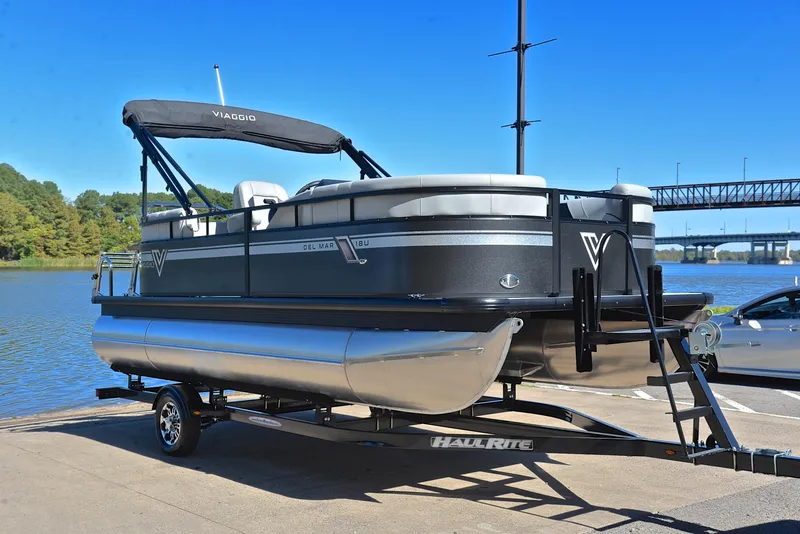 Slide: The Image of 2023 Viaggio DM18U pontoon boat on trailer by a lake. - 15