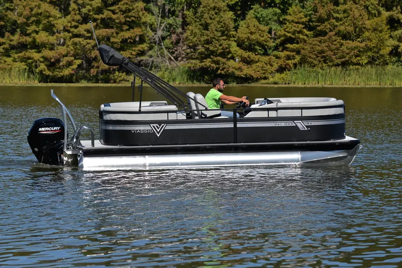 Slide: The Image of 2023 Viaggio DM18U pontoon boat cruising on a lake. - 6