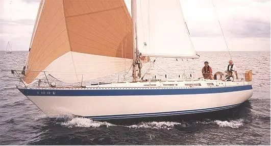 The Image of 1983 Wauquiez 38 MKI sailboat navigating open waters with full sails. - 0