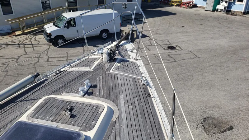 Slide: The Image of Deck view of 1983 Wauquiez 38 MKI sailboat in a marina setting. - 13