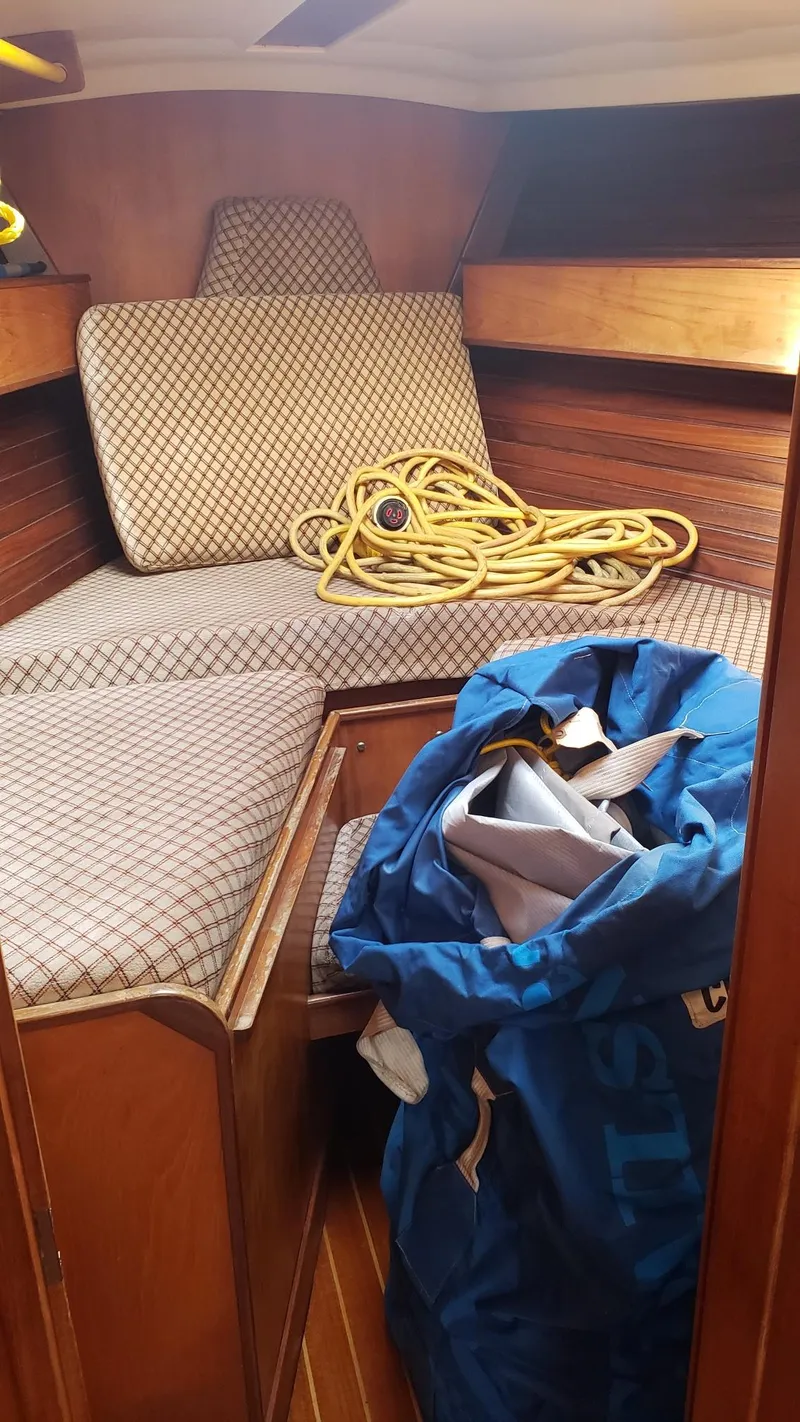 Slide: The Image of Interior of 1983 Wauquiez 38 MKI sailboat with rope and blue bag. - 26