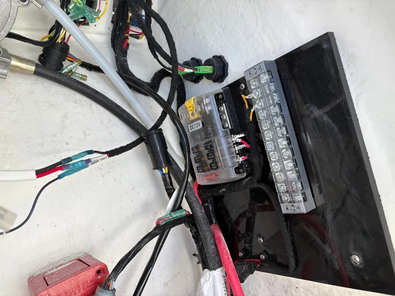 Slide: The Image of Electrical wiring and fuse box inside 2024 Highfield Sport 390 boat. - 16
