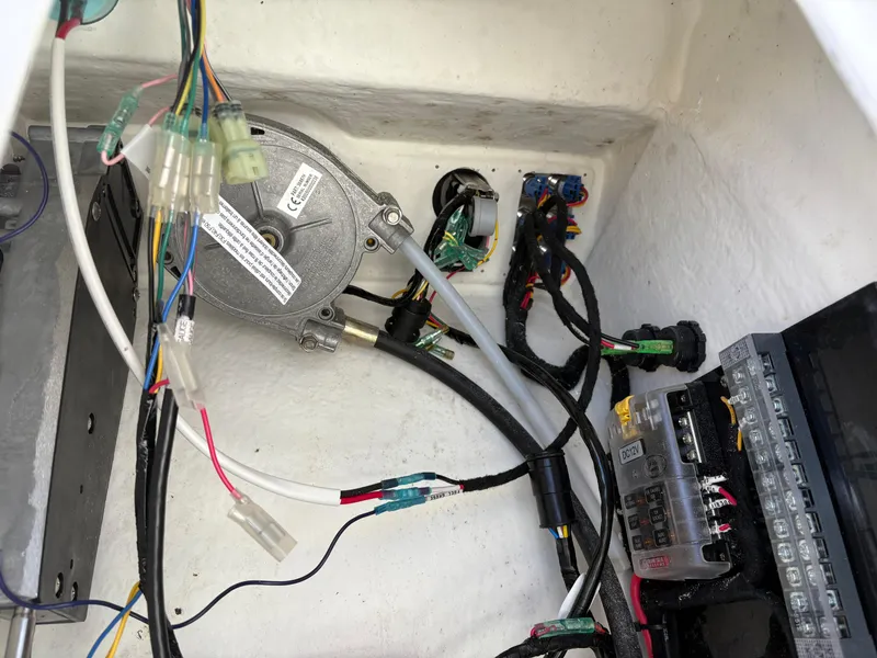 Slide: The Image of Electrical wiring and components inside a 2024 Highfield Sport 390 boat. - 17
