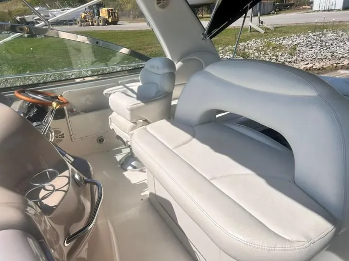 Slide: The Image of Interior of 2000 Sea Ray 410 Sundancer boat with white leather seating. - 10