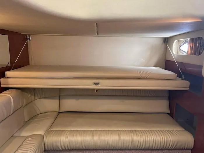 Slide: The Image of Interior cabin of 2000 Sea Ray 410 Sundancer with beige seating. - 20