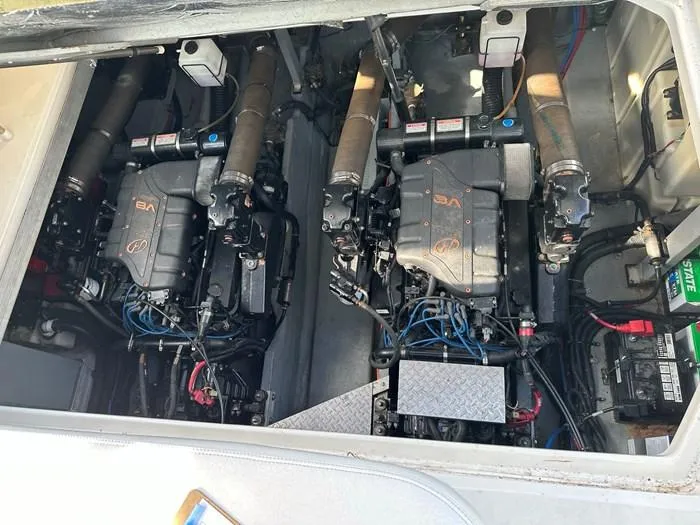 Slide: The Image of Engine compartment of 2000 Sea Ray 410 Sundancer with dual engines visible. - 3