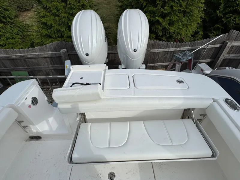 Slide: The Image of 2025 Regulator 23 boat interior with white seating and steering console. - 11