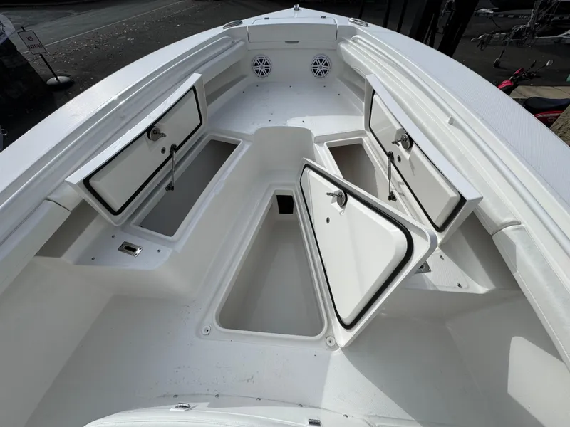 Slide: The Image of Regulator 23 boat, 2025 model, featuring a blue HoseCoil and saltwater faucet. - 15