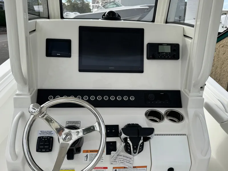 Slide: The Image of Yamaha display on 2025 Regulator 23 boat dashboard, showing engine RPM and navigation map. - 7